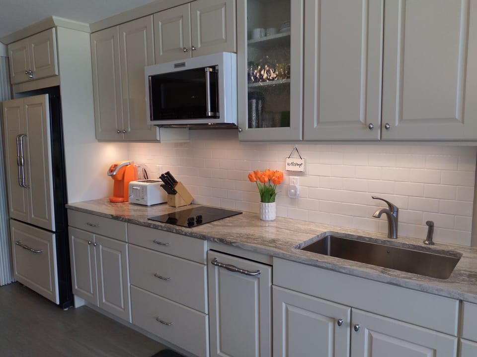 Well-equipped kitchen with Kitchen Aid appliances 