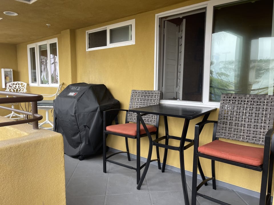 BBQ grill and additional seating while cooking 