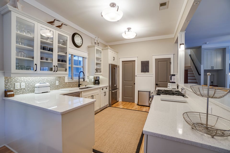 The kitchen has a large pantry and plenty of room for multiple cooks
