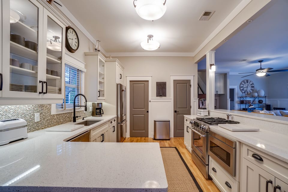 Fully stocked chefs kitchen with gas range and microwave drawer. 