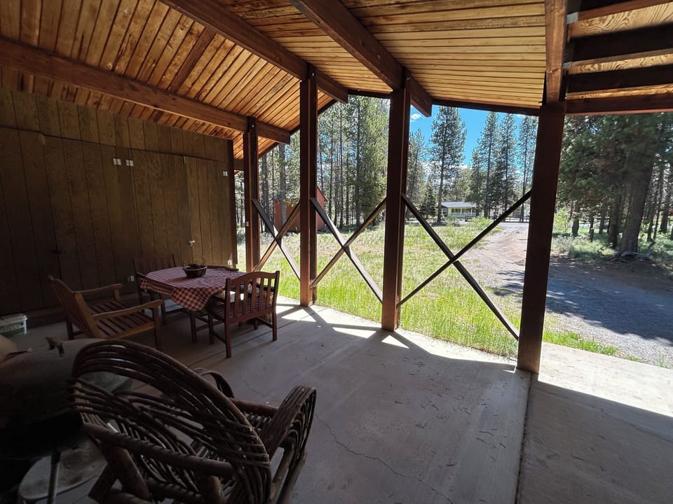 View from front patio with charcoal BBQ and dining table