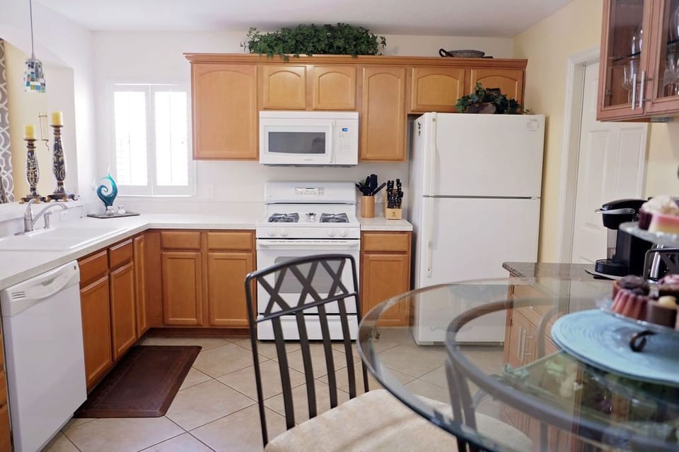 Spacious eat-in kitchen. Door to garage - car & golf cart for Villages enjoyment