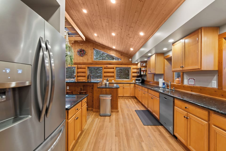Massive kitchen with plenty of cabinets, drawers, and countertop space.