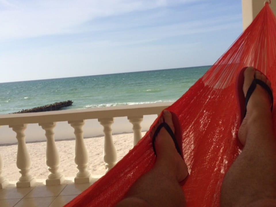 Rest in a hammock on the beachfront terrace