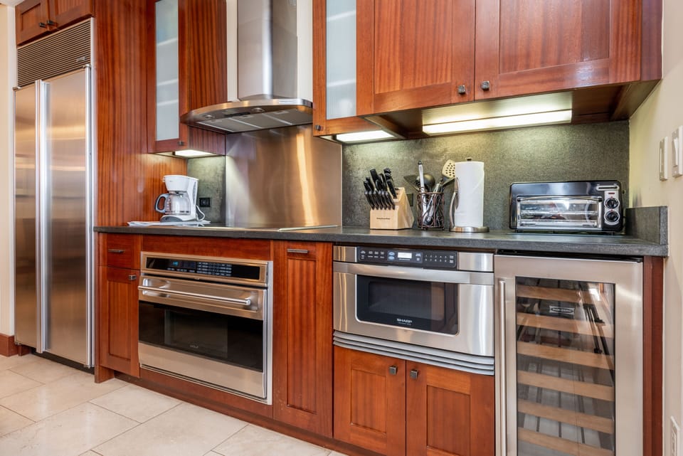 Cook meals with high-end appliances, including a wine cooler.
