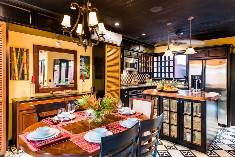 The Dining Room and Kitchen are separated by a wet bar and curio/island