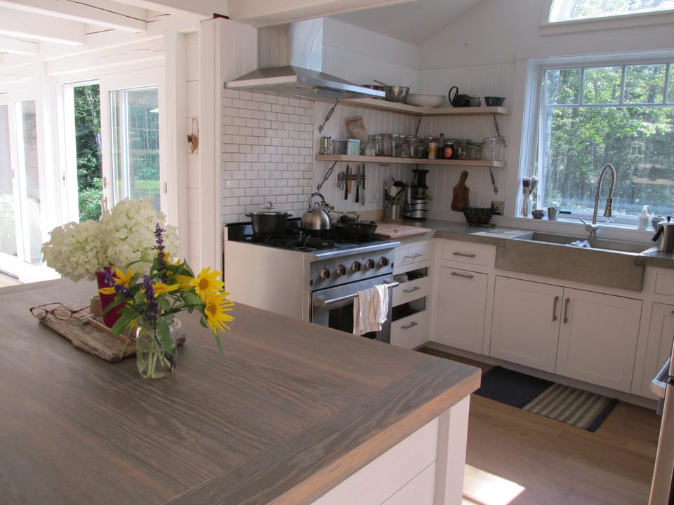 Custom Kitchen with pro. gas range, cement counters, extra deep sink, dishwasher