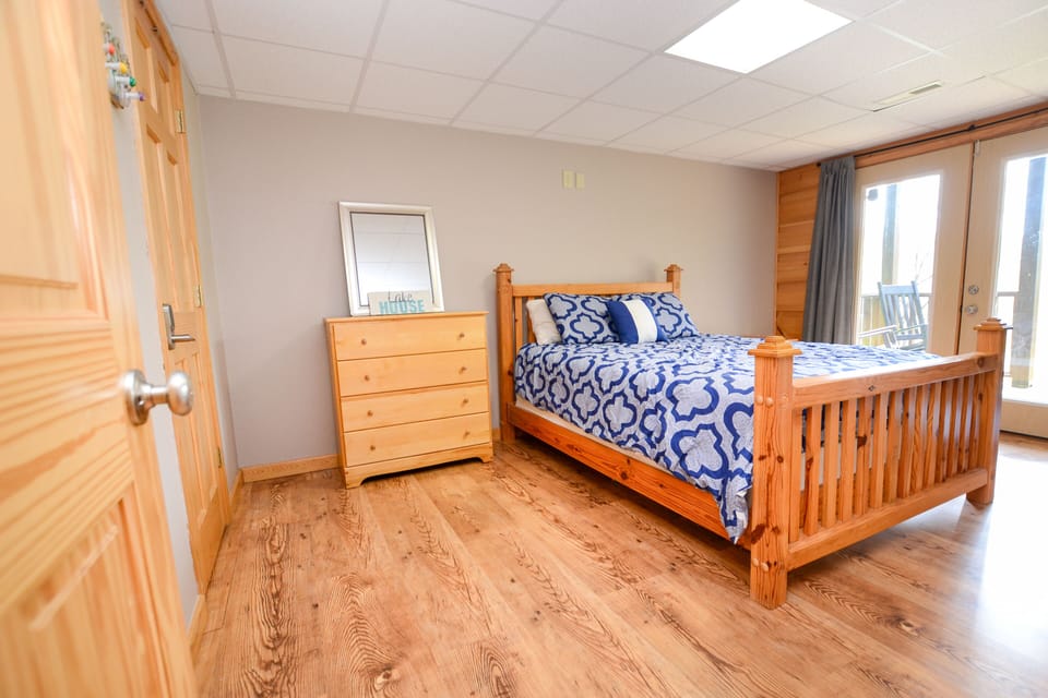 Downstairs queen bed with french doors to lower deck
