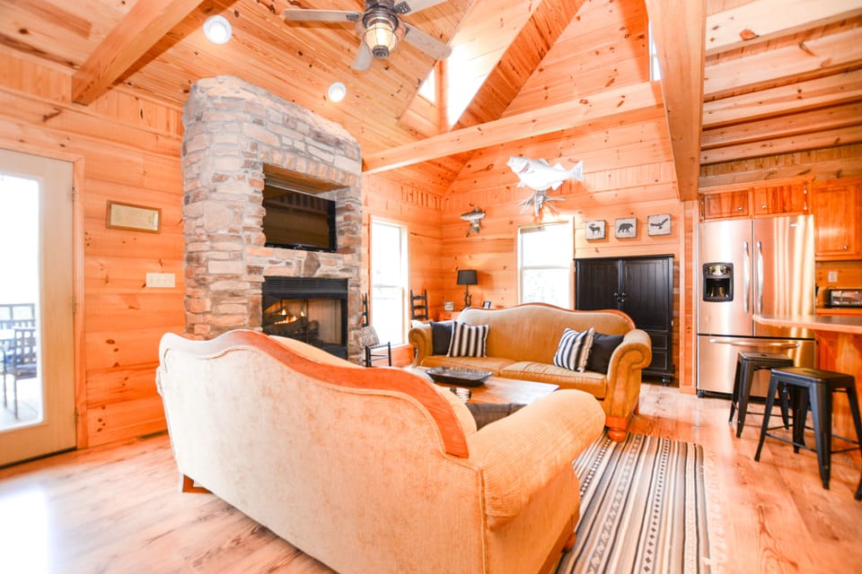 Living room with gas fireplace and vaulted ceilings