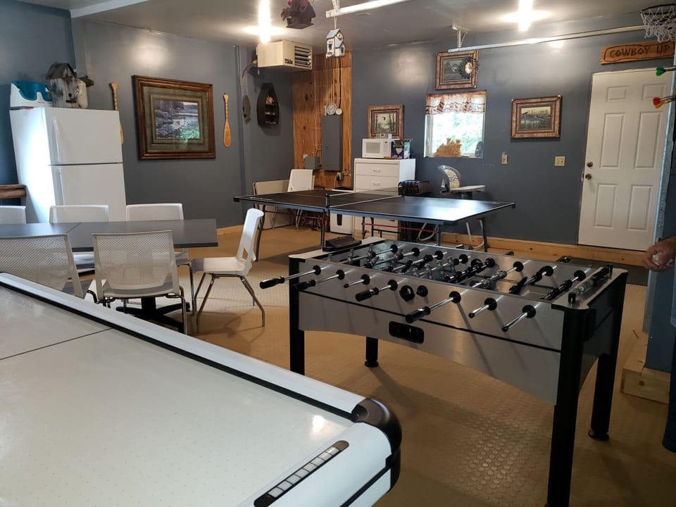 Large game room with air hockey, foosball and ping pong