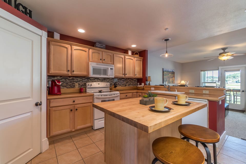 Large, fully equipped kitchen with full sized refrigerator, microwave & pantry.