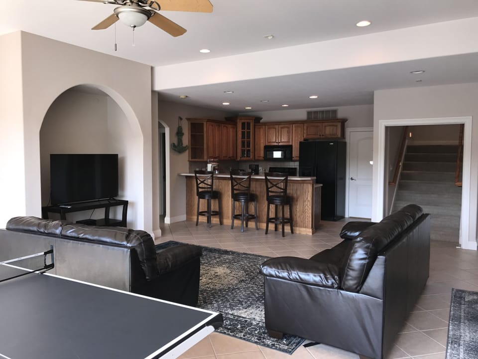 lowel level great room and 2nd full kitchen with stove , microwave, dishwasher and refrigerator 
