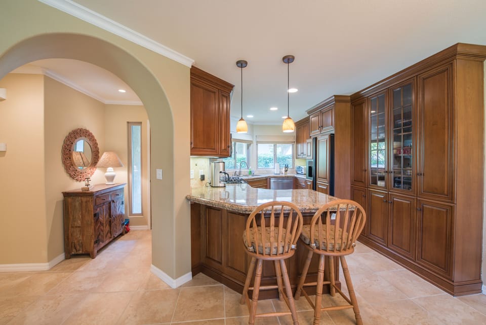 Two barstools at kitchen counter bar top