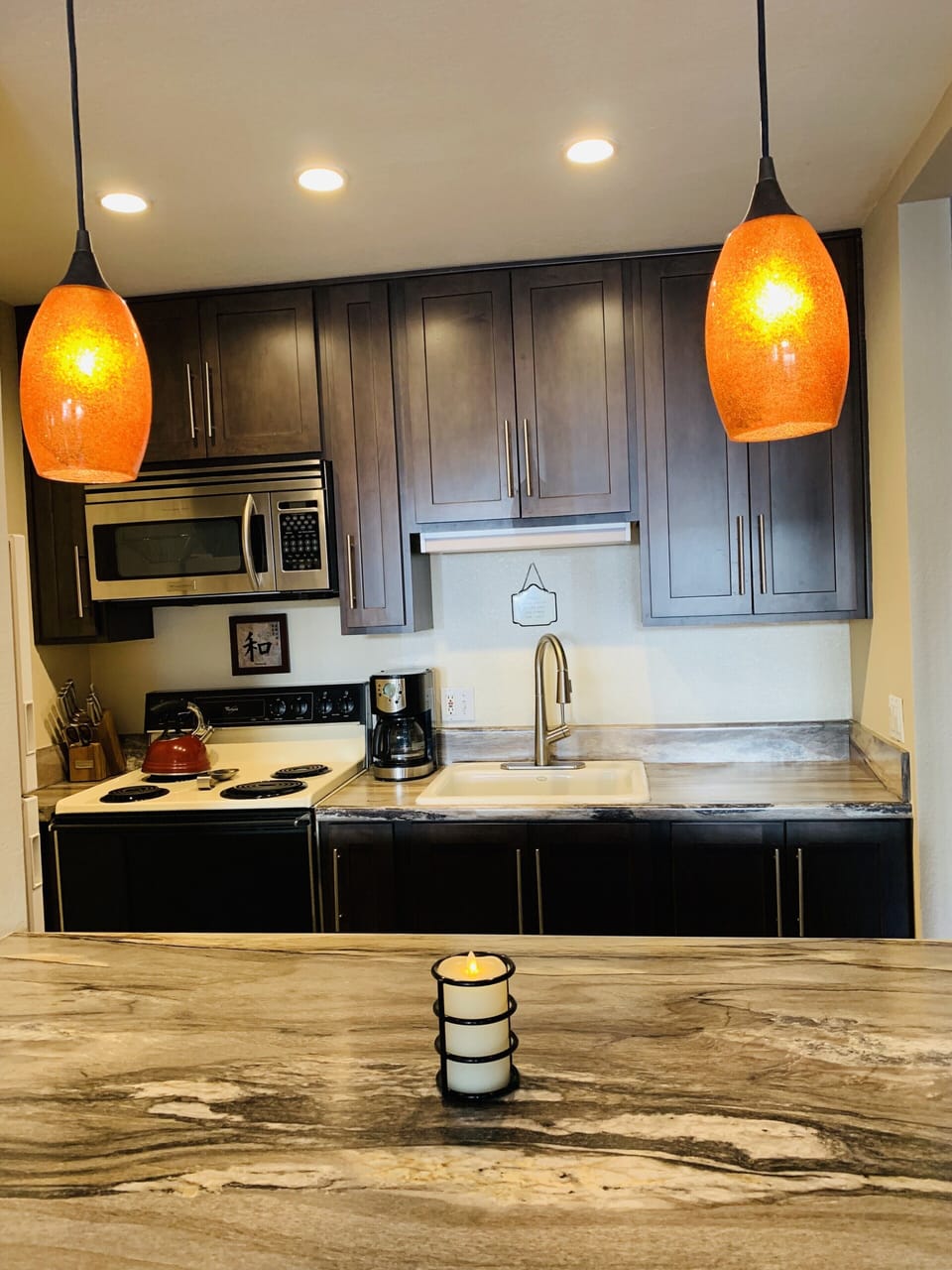 Kitchen is fully stocked with all the  cookware and dishware you could need.  

