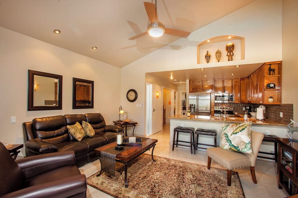 Living room with leather recliner and 50' flat screen