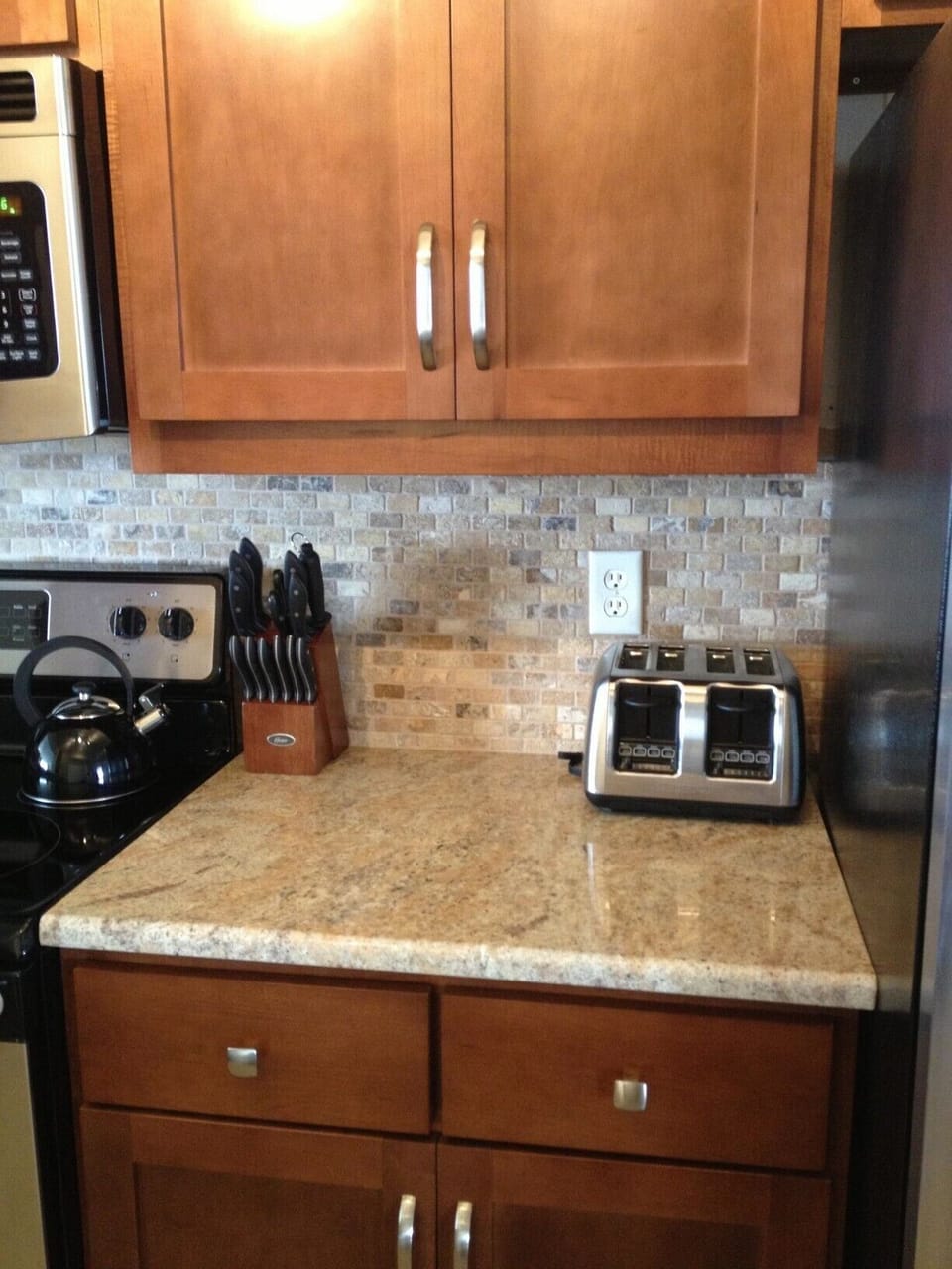 Granite Counter tops run to the stone back splash