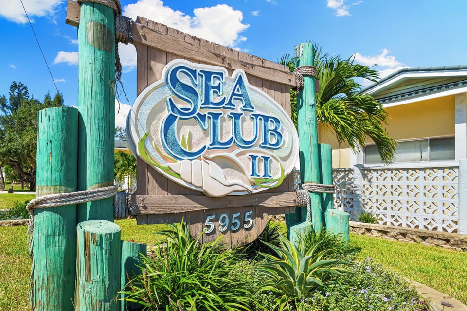 Welcome to Sea Club II, nestled in a sunny coastal setting with lush tropical landscaping and a relaxed beach-town atmosphere.