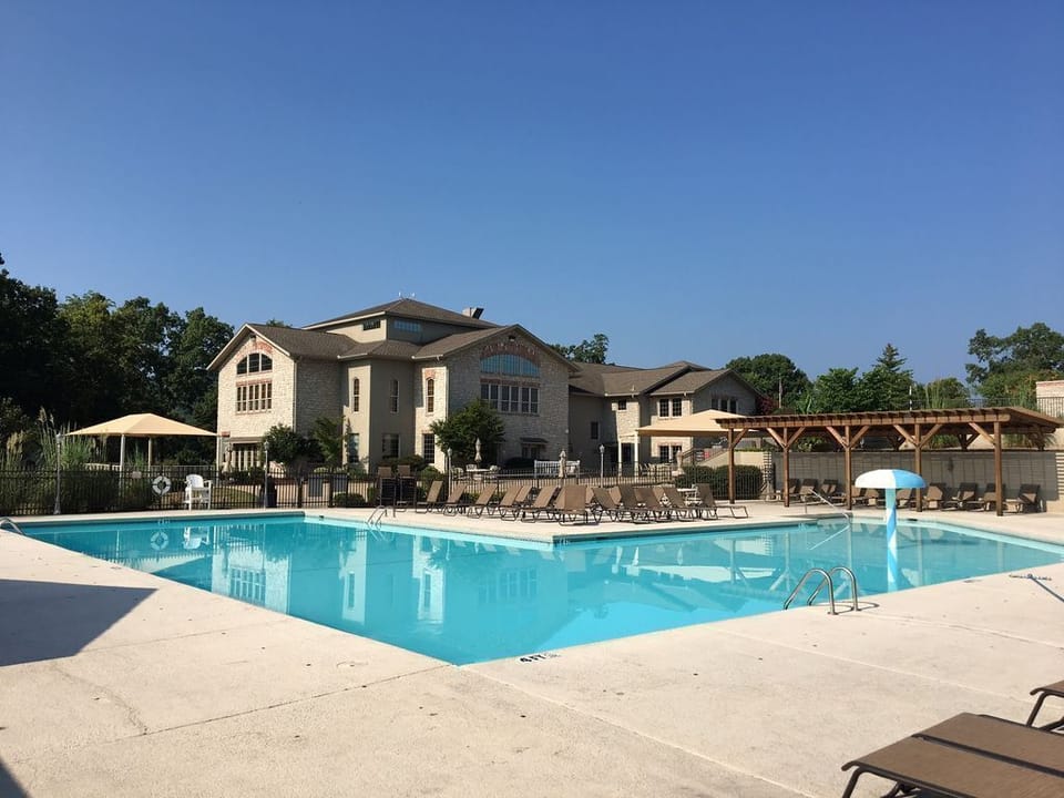 Large pool with pergola for shade