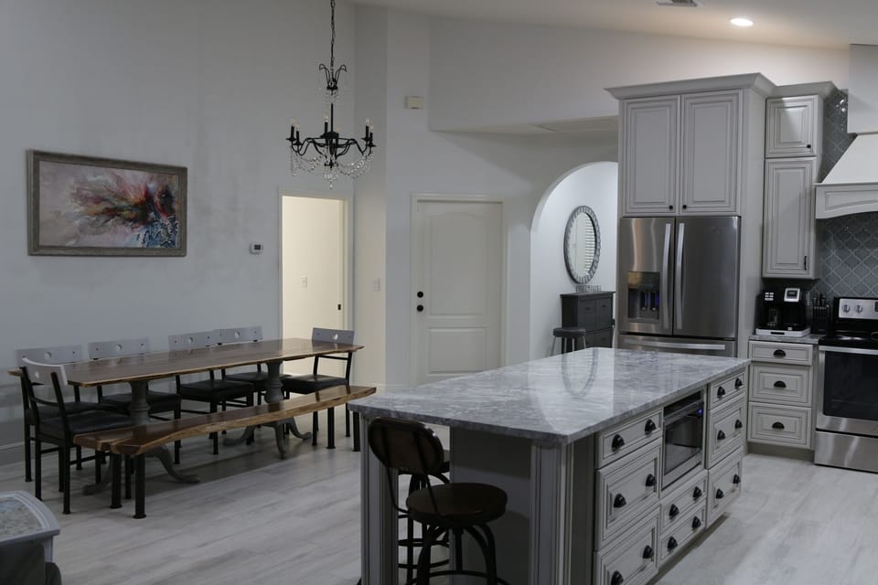 French country kitchen /dining area with owner made live edge 8f walnut table 