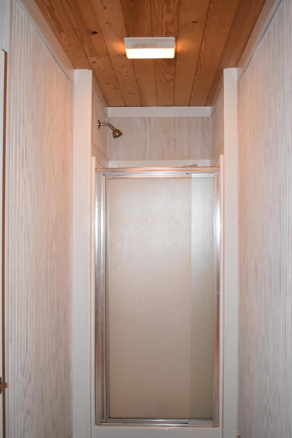 The second floor bathroom has a shower stall. 