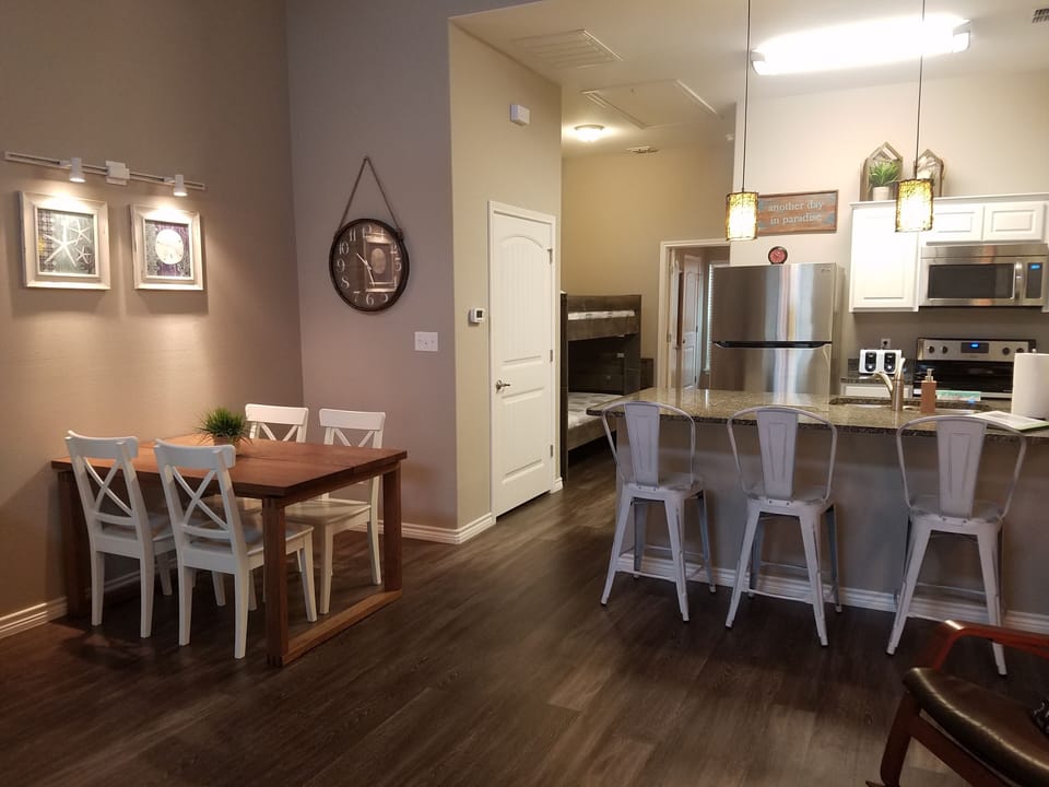 Great open floor plan. Dining table on left, kitchen to the right. 