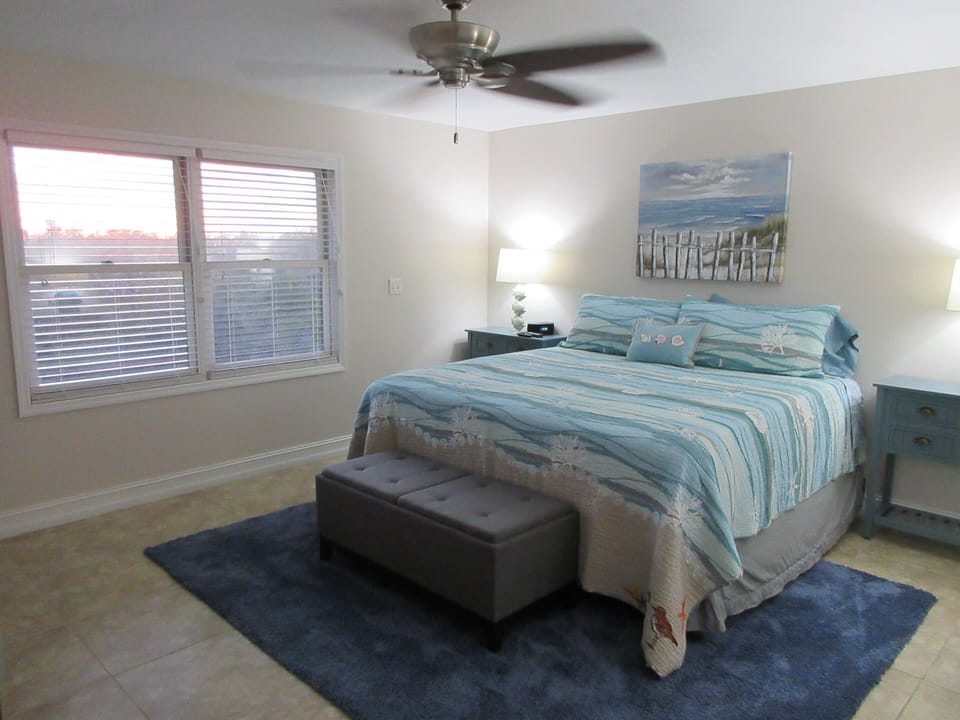 MASTER BEDROOM WITH KING BED AND CANAL/ SUNSET VIEW