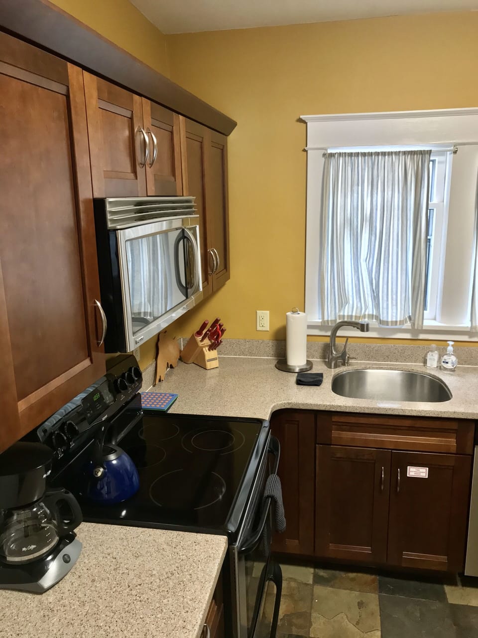 Fully stocked kitchen with stainless steel appliances