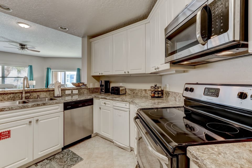 Fully Equipped Kitchen and Bar Stool Area