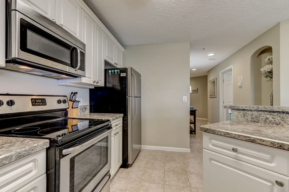 Fully Equipped Kitchen and Bar Stool Area