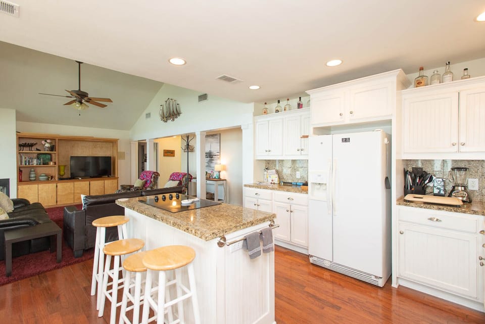 Gather around the island and watch the chef prepare your meal!