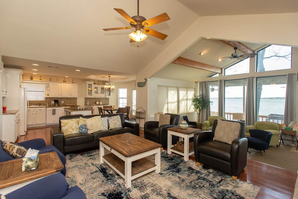 Open concept living/dining/kitchen with views of the water from every angle!