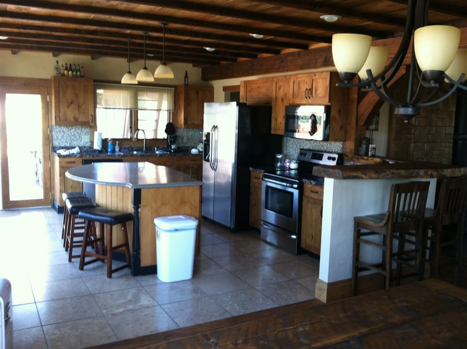 Gourmet kitchen with island and new stainless steel appliances