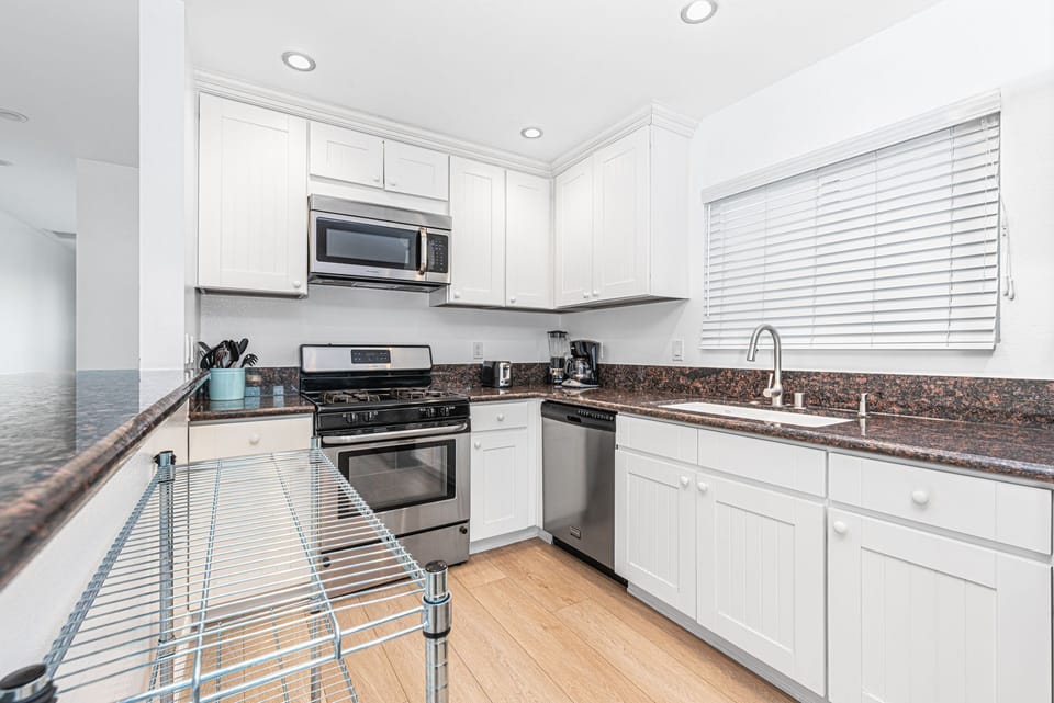 The kitchen comes stocked with gear for meal prep and dining (dishes, glassware, flatware, cookware, bakeware, etc.), as well as small and major appliances.
                