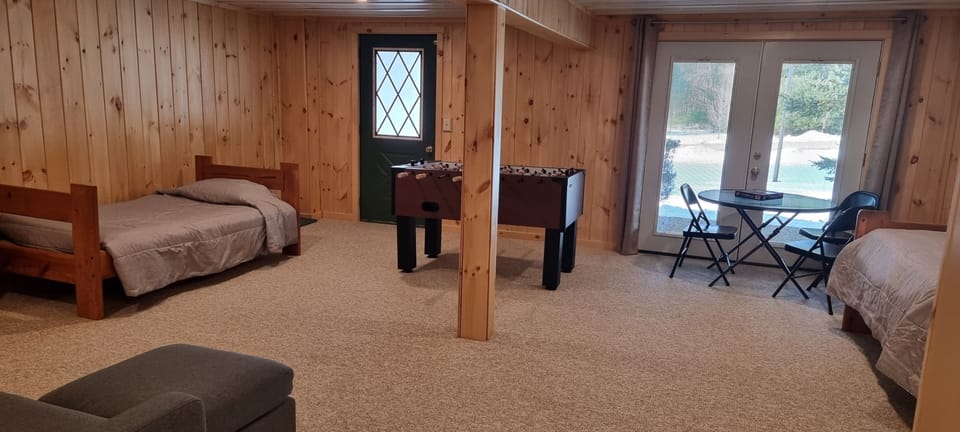 two sturdy twin beds in recreation room, newly created 2023