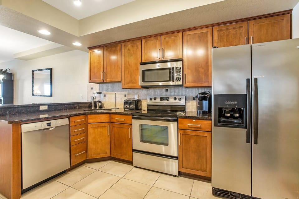 Kitchen is accessorized like home, except there are ocean waves to your left...