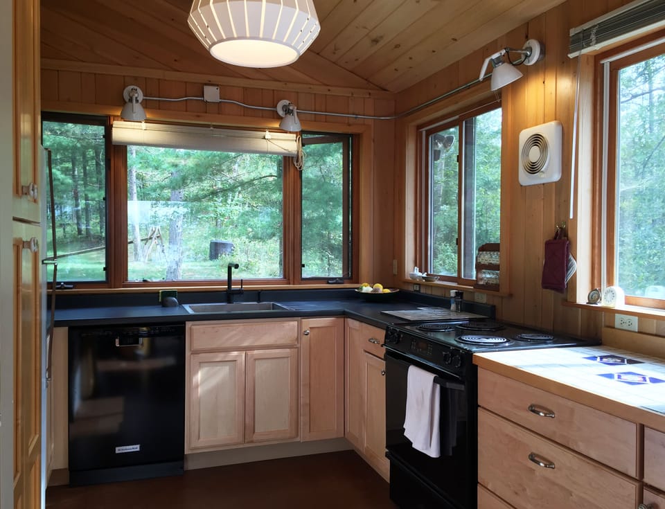 Well stocked kitchen with views to nature everywhere you look
