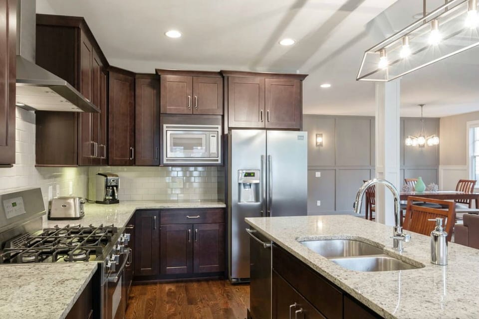 Kitchen has granite countertops, stainless steel appliances, and fully equipped.