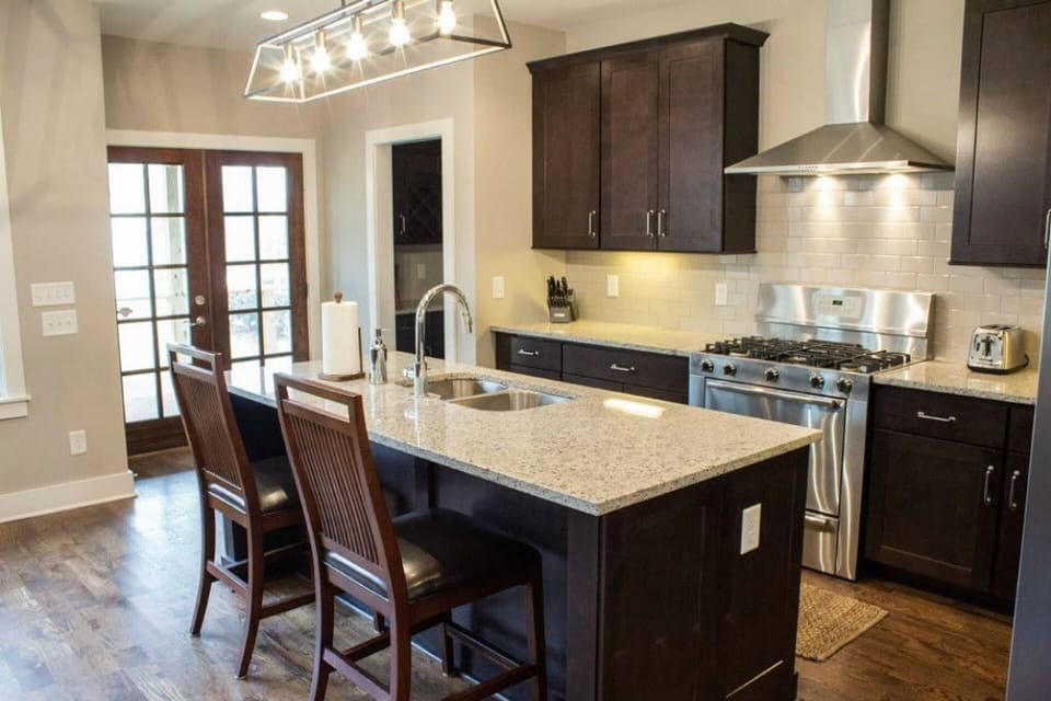 This kitchen has great flow thanks to the large granite island.