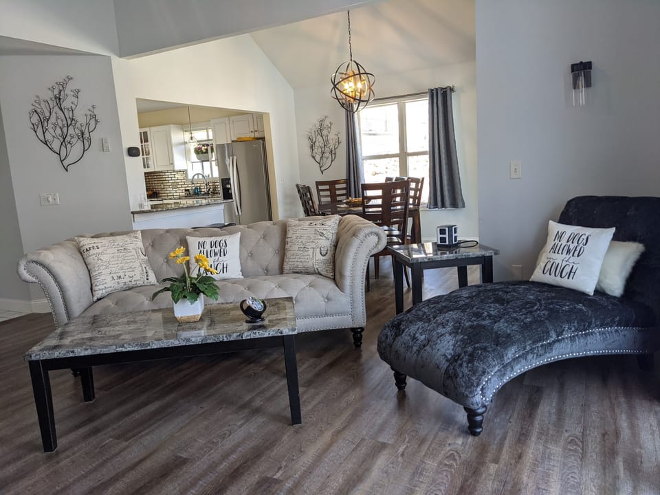 Expansive View of the Living Room and Dining Room area with entry to the Kitchen