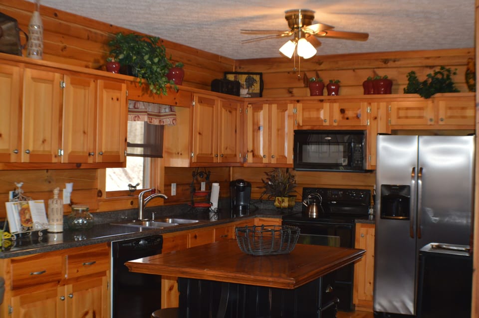 Spacious kitchen with island/breakfast table for four.