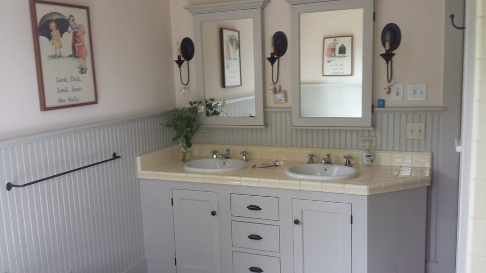 Master bath sink area, w/ separate tub and shower.
