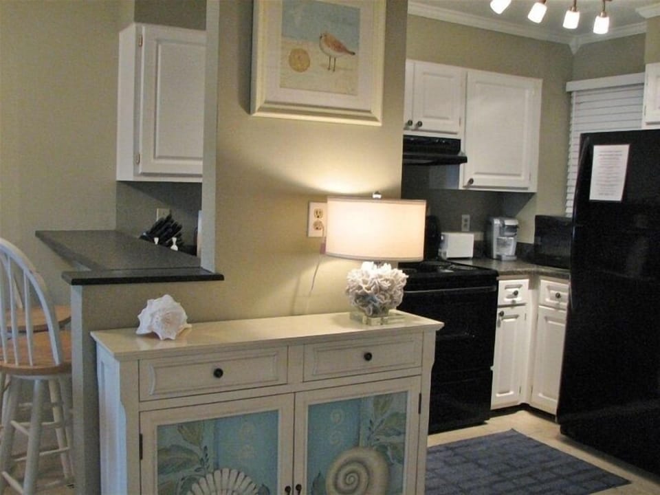 Fully equipped kitchen with fridge, stove, oven, microwave and dishwasher