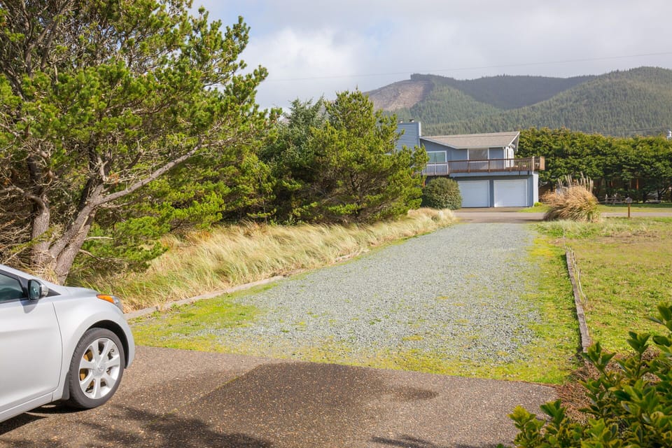 Long driveway off quiet street with grassy front yard. Great biking/hiking area!