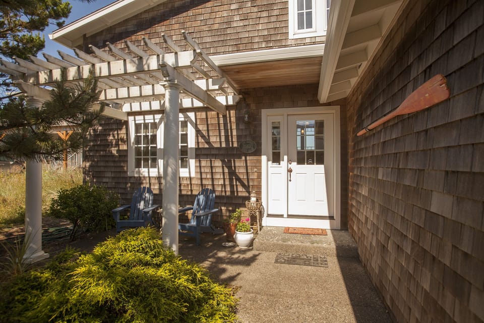 Entrance to house with deck chairs