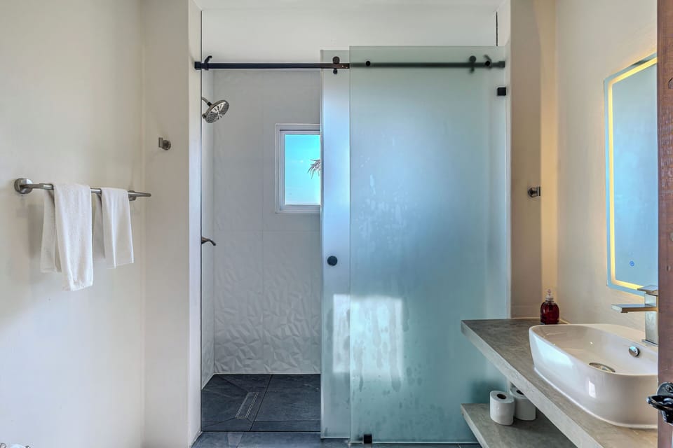 Brand new master bathroom as of late 2025 ocean view shower!