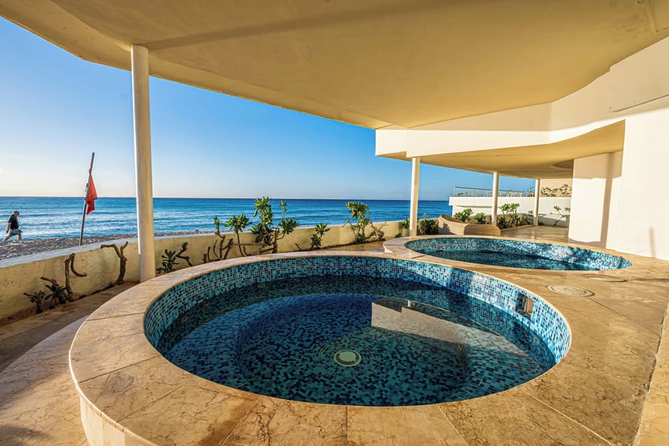 Two jacuzzis off the fitness center and spa, one cool plunge and the other hot