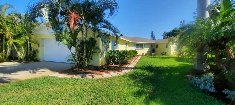 Front door of home, double garage and large driveway