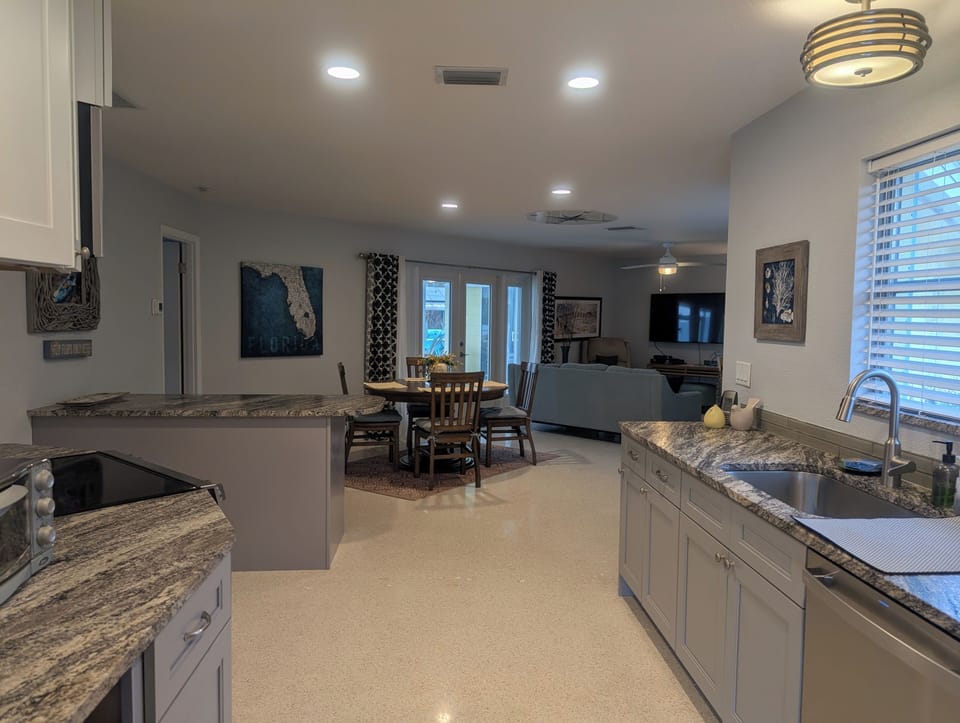 Open concept kitchen / dining / living area
