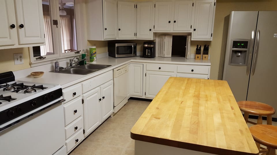 Kitchen - toaster, microwave, blender, gas range, toaster oven and baking dishes