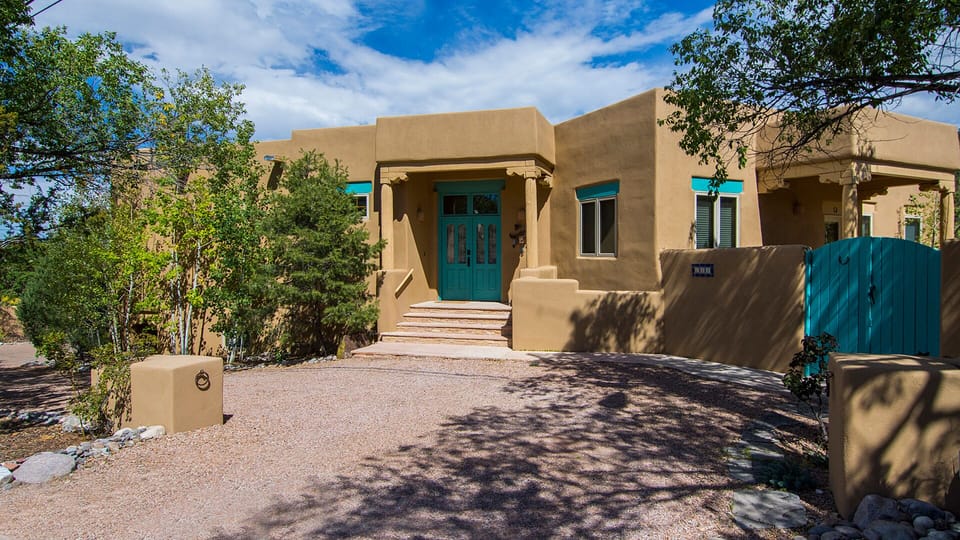 Front portal and entry to the main floor with French doors & long circular drive